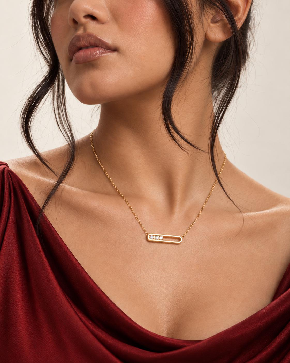 Gold jewellery worn with garnet satin
